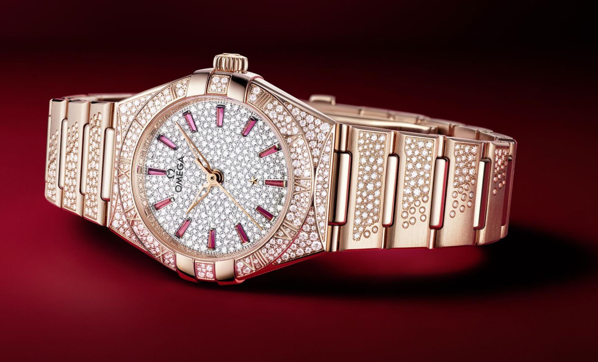 The diamond-paved dial fake watch has ruby hour marks.