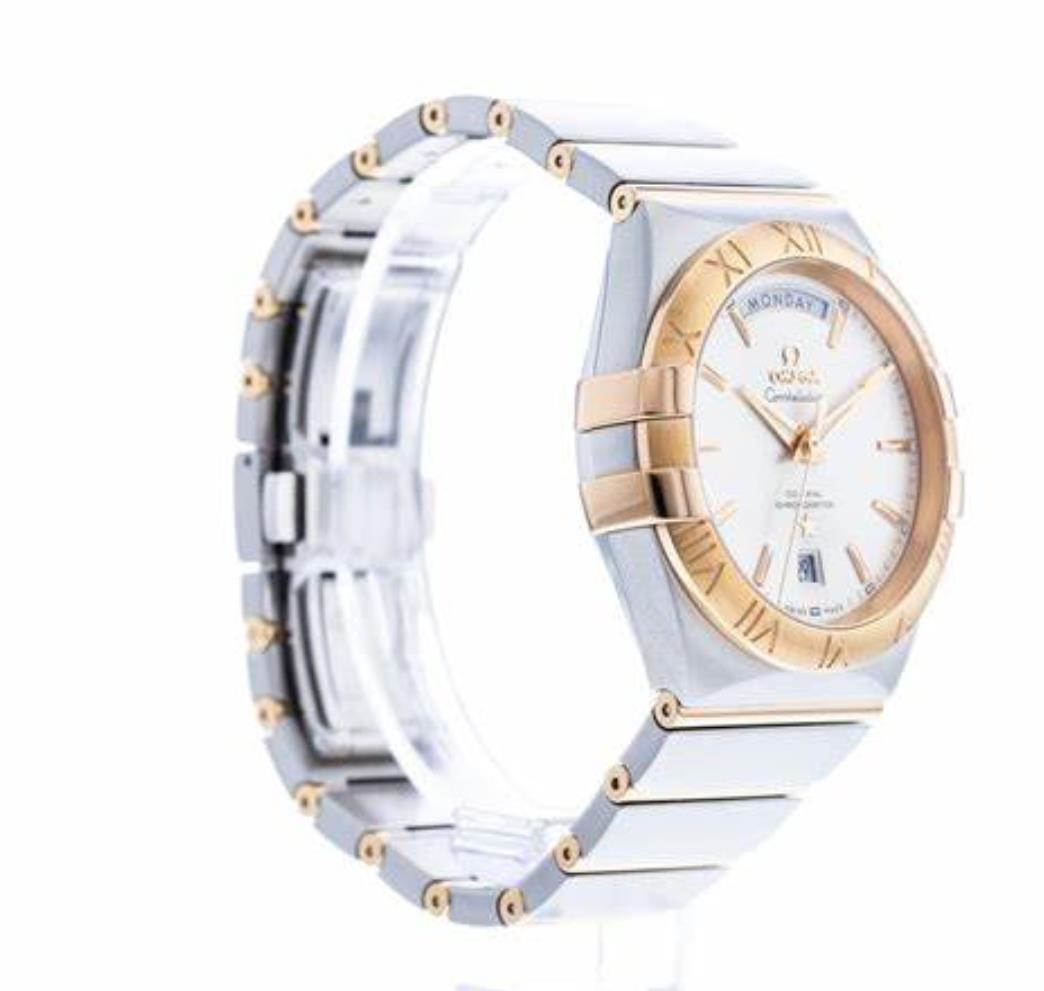 The silvery dial fake watch is made from polished 18k red gold and stainless steel.